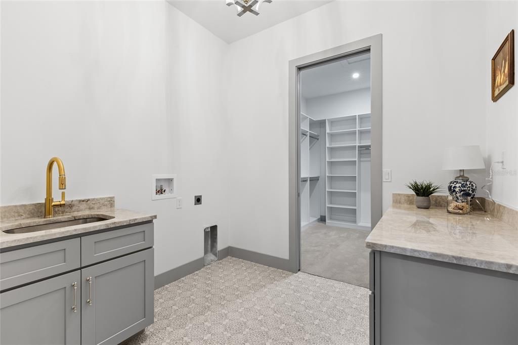 Laundry room off the master closet