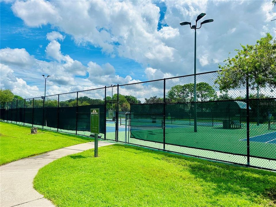 Tennis Courts with lights at nightime