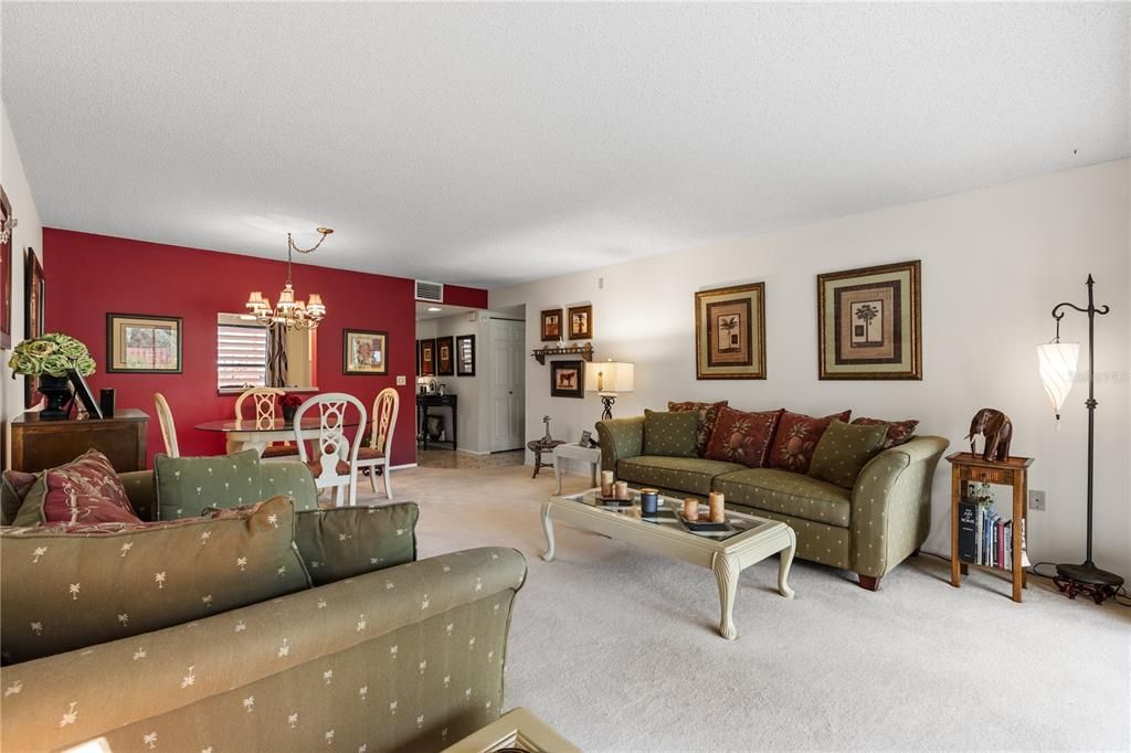 Great room featuring sliding glass doors to the screened-in lanai