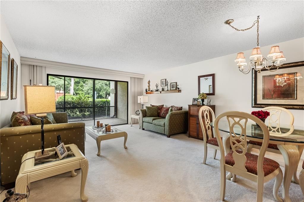 Great room featuring sliding glass doors to the screened-in lanai