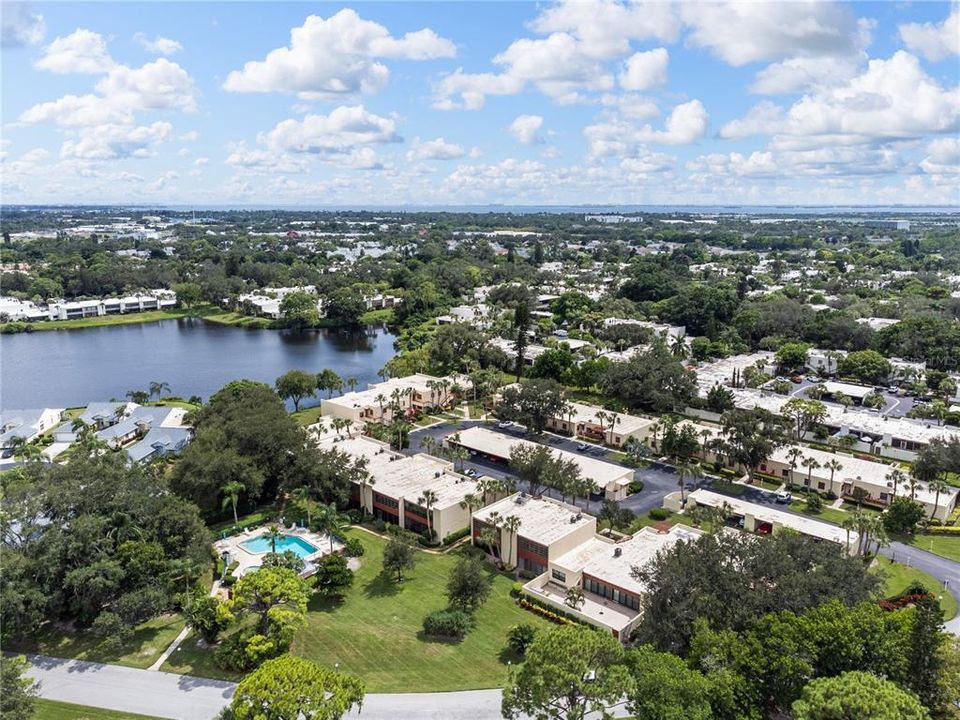 Aerial of the community showing the community pool behind the building.