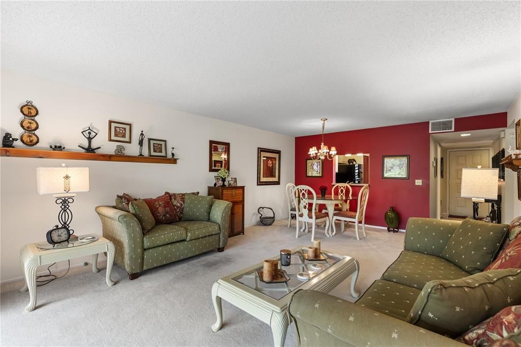 Great room featuring sliding glass doors to the screened-in lanai