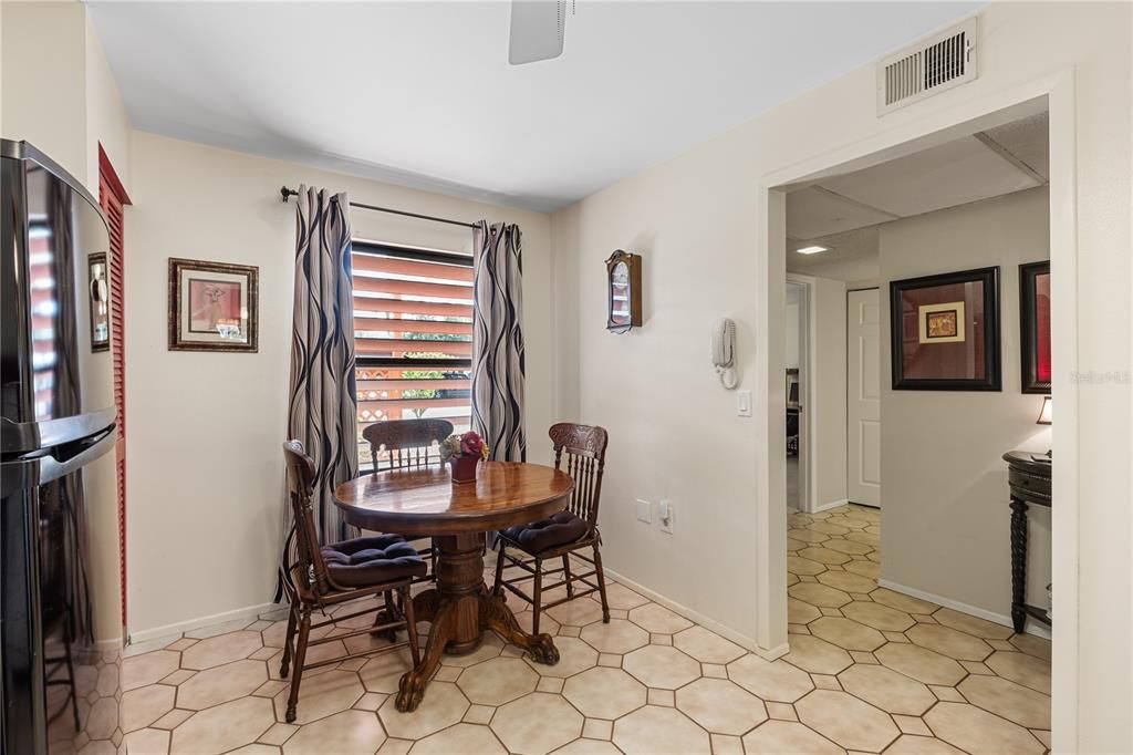 Spacious kitchen featuring ample cabinetry, laundry, and dinette.