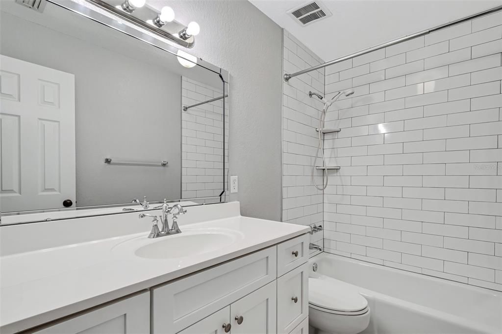 Bathroom #2 is immediately adjacent and has been updated with all new fixtures and tile.