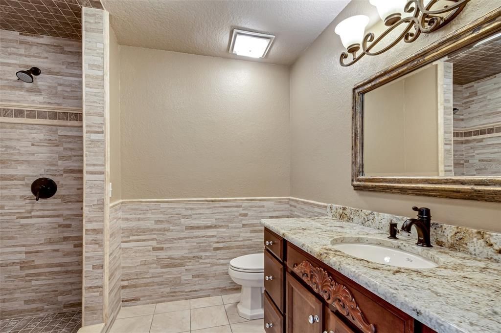 With a fully tiled walk-in shower (no tub in the bathroom)