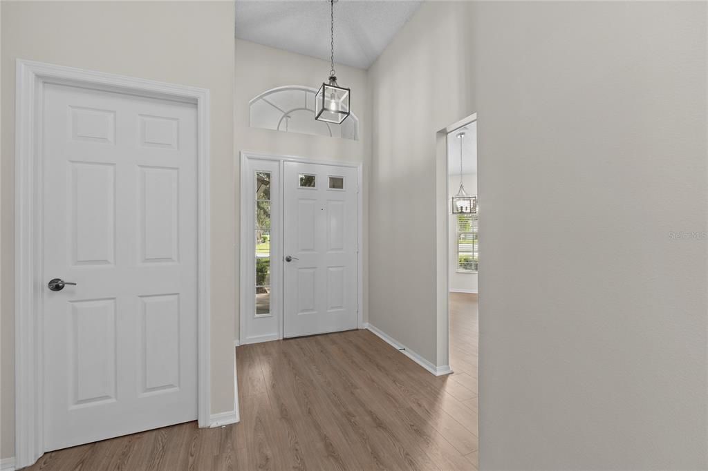 This Foyer is a welcoming space with new lighting and has lots of storage.