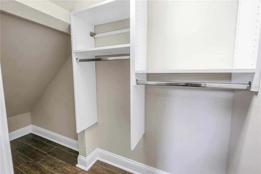 Large walk-in closet with built-in shelving