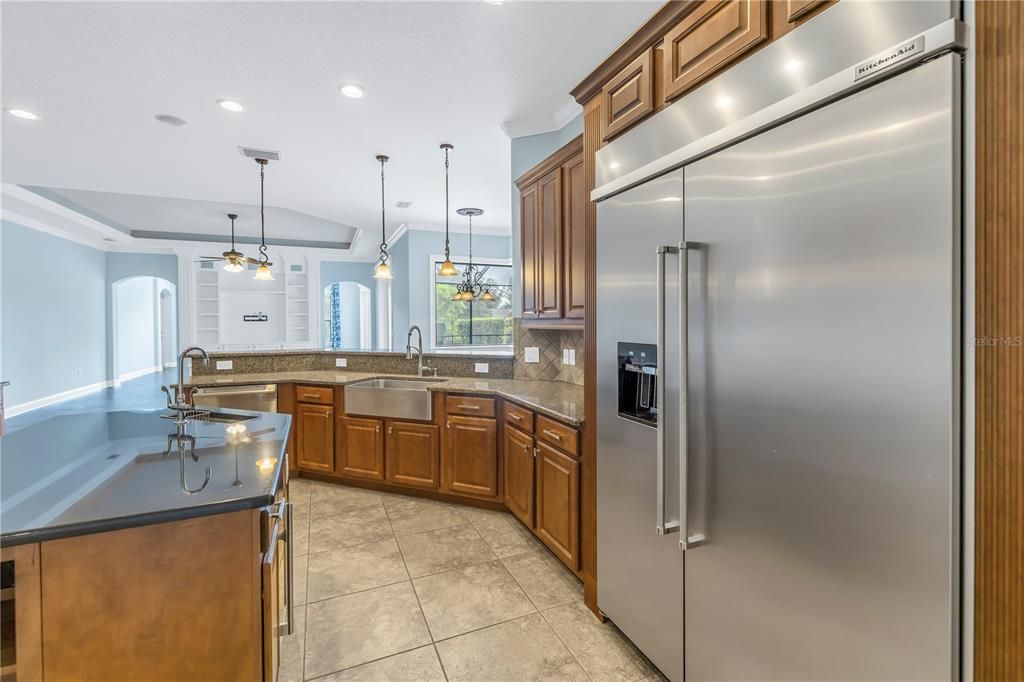 Kitchen with a new massive sized refrigerator!