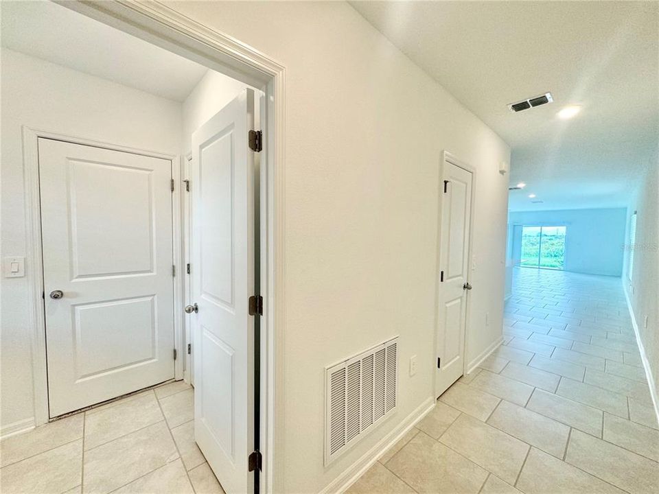 Foyer entrance with utility room/garage entrance