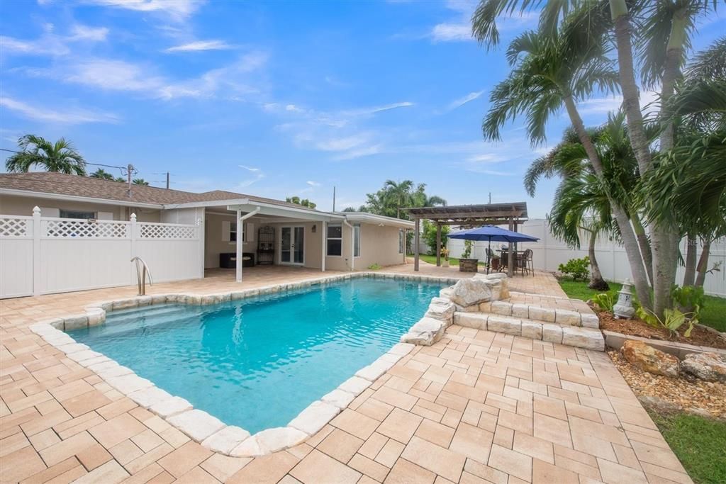 Lush backyard with salt water pool