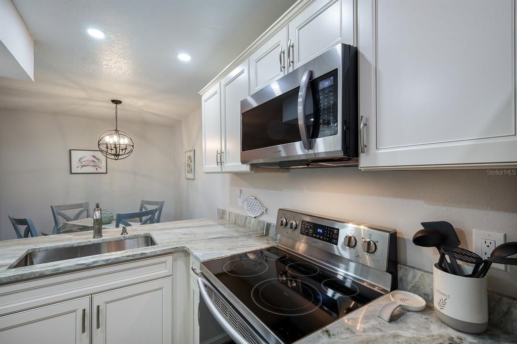 Lightly used stainless appliances compliment the modern kitchen.