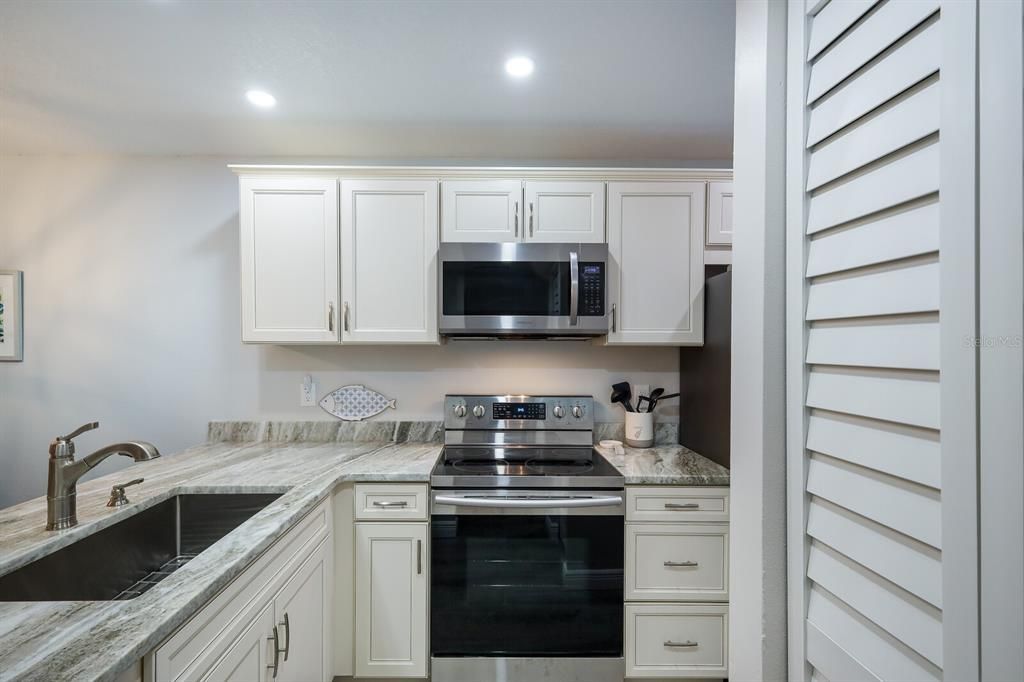 Gorgeous modern kitchen with attractive finishes and plenty of counter space.