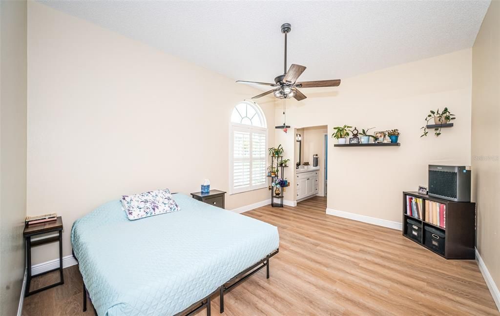 Downstairs Primary Bedroom - plantation shutters and impact rated windows