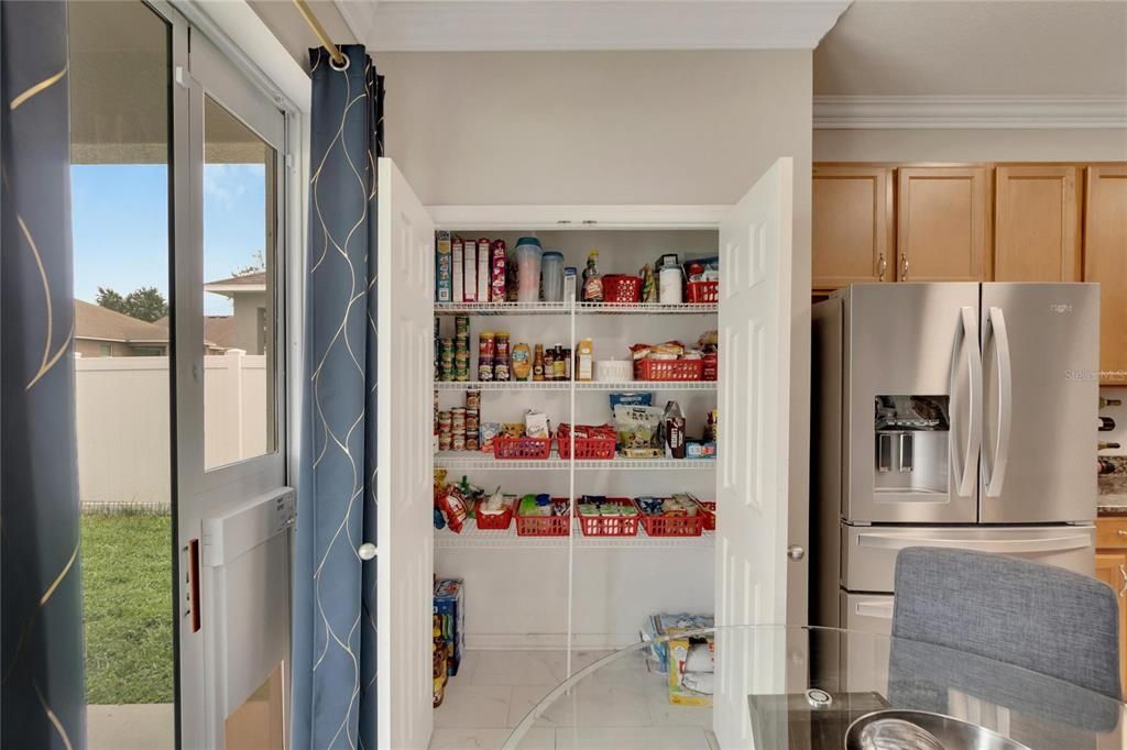 Closet pantry offers storage space galore.