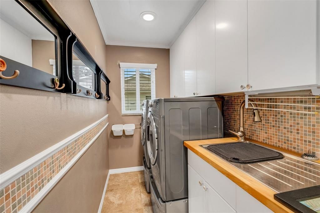 Large inside laundry conveniently located between the kitchen and garage~