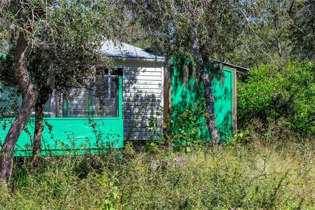 BACK VIEW OF STUDIO WITH SHED AND BALCONY