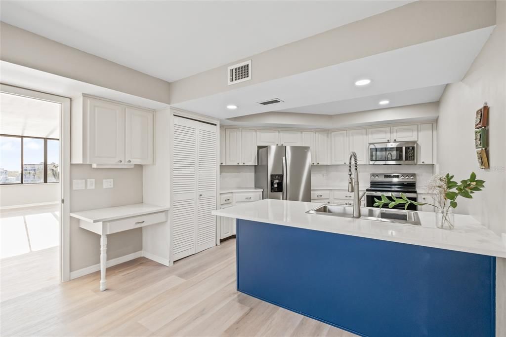 Renovated Kitchen! New Quartz countertops, Island, appliances, sink, faucet, lighting. Pantry in the kitchen