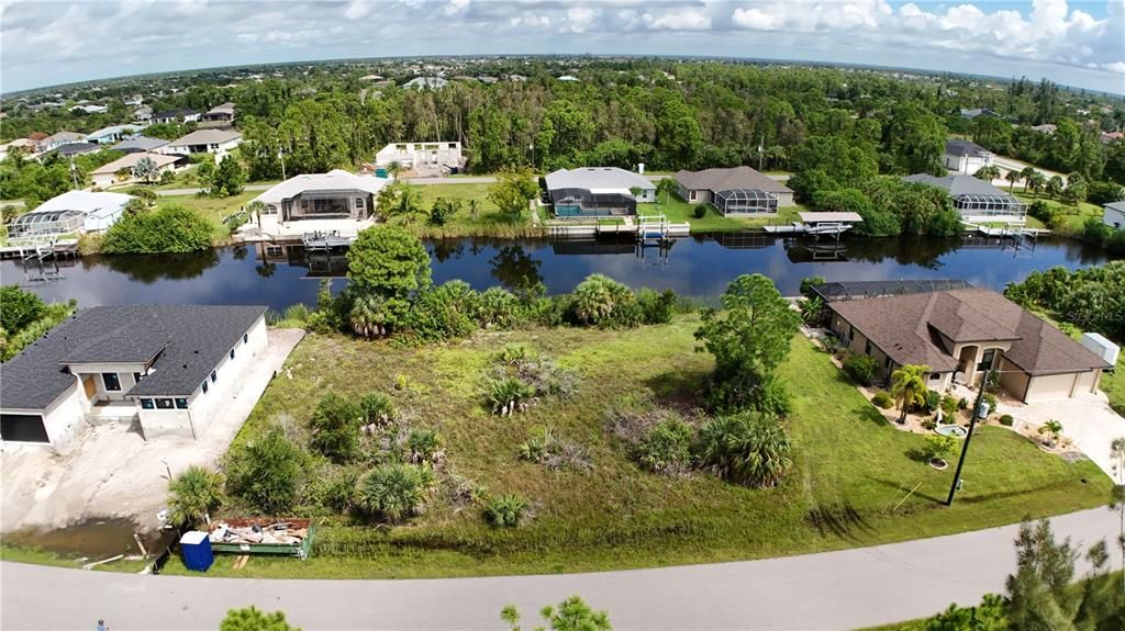 The lot is next to the house on the right.