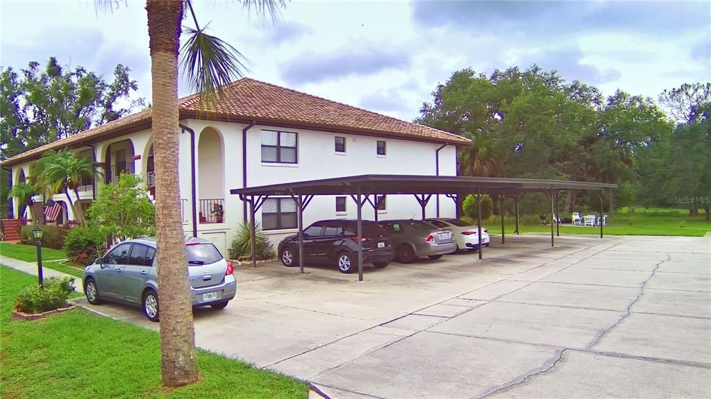 Right side view with carport.