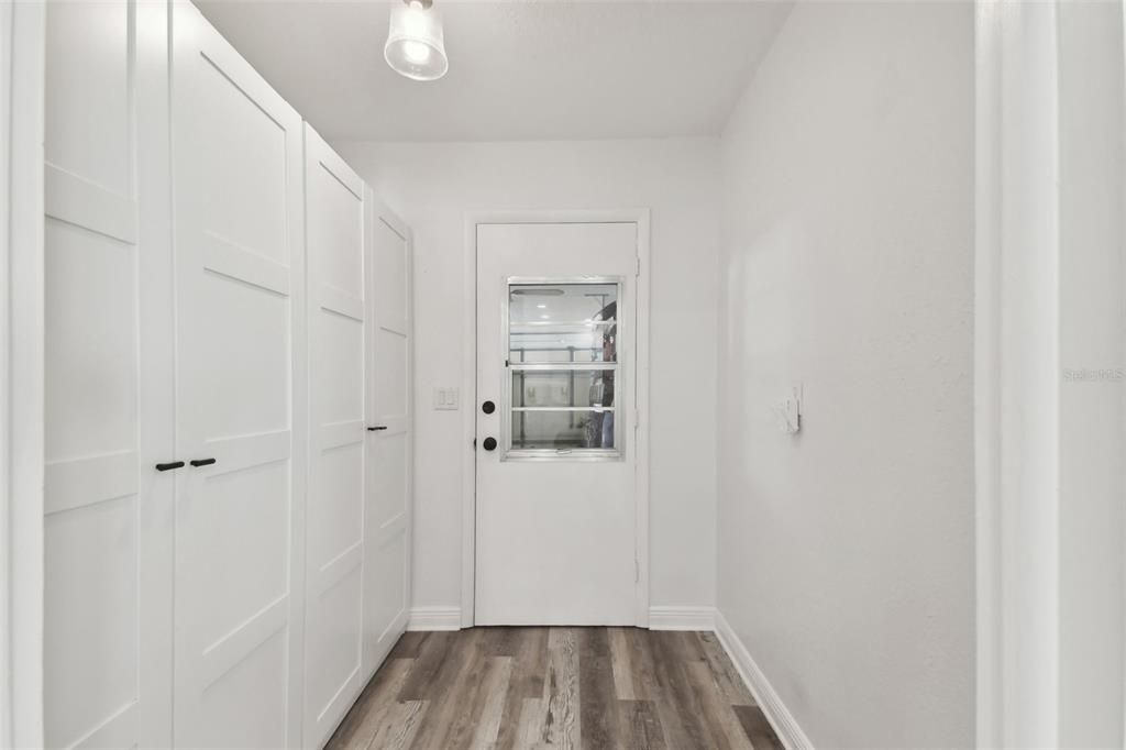 Pantry area right off the kitchen, door leading to garage. Makes bringing groceries in easy