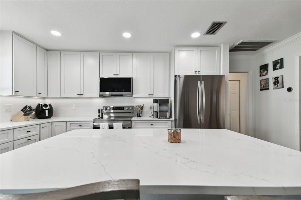 Large kitchen island provides plenty of work space, making cooking a joy.