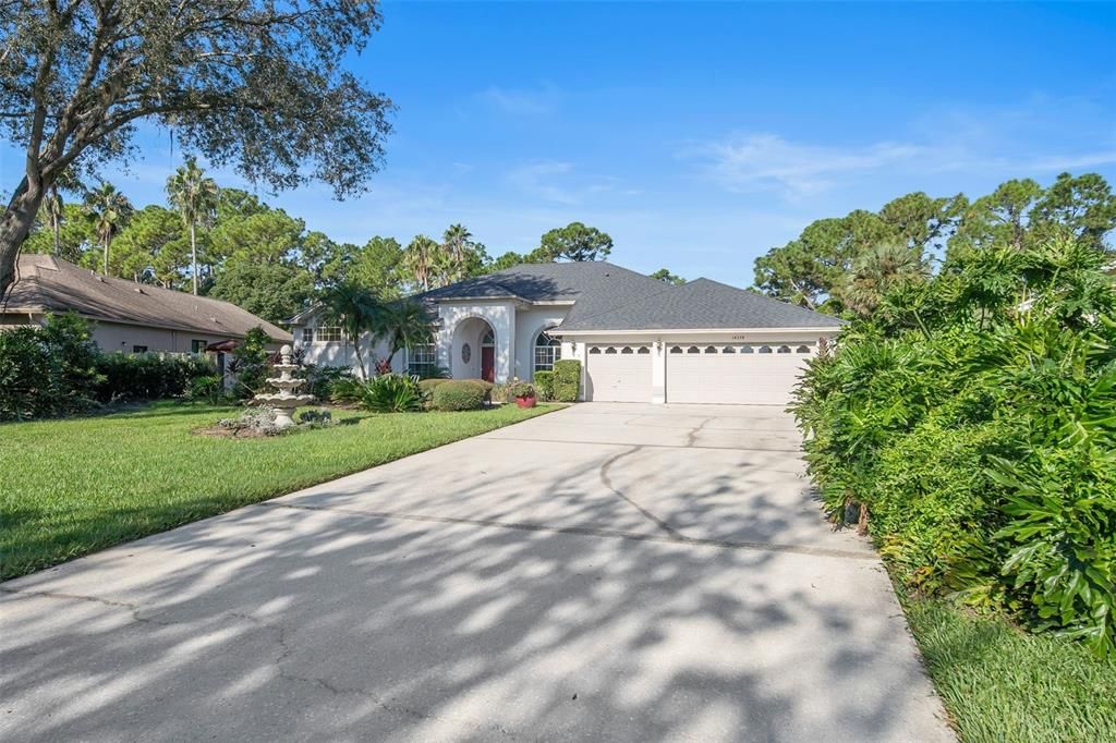 Set on an oversized lot, the expansive driveway offers ample parking for guests and gatherings.