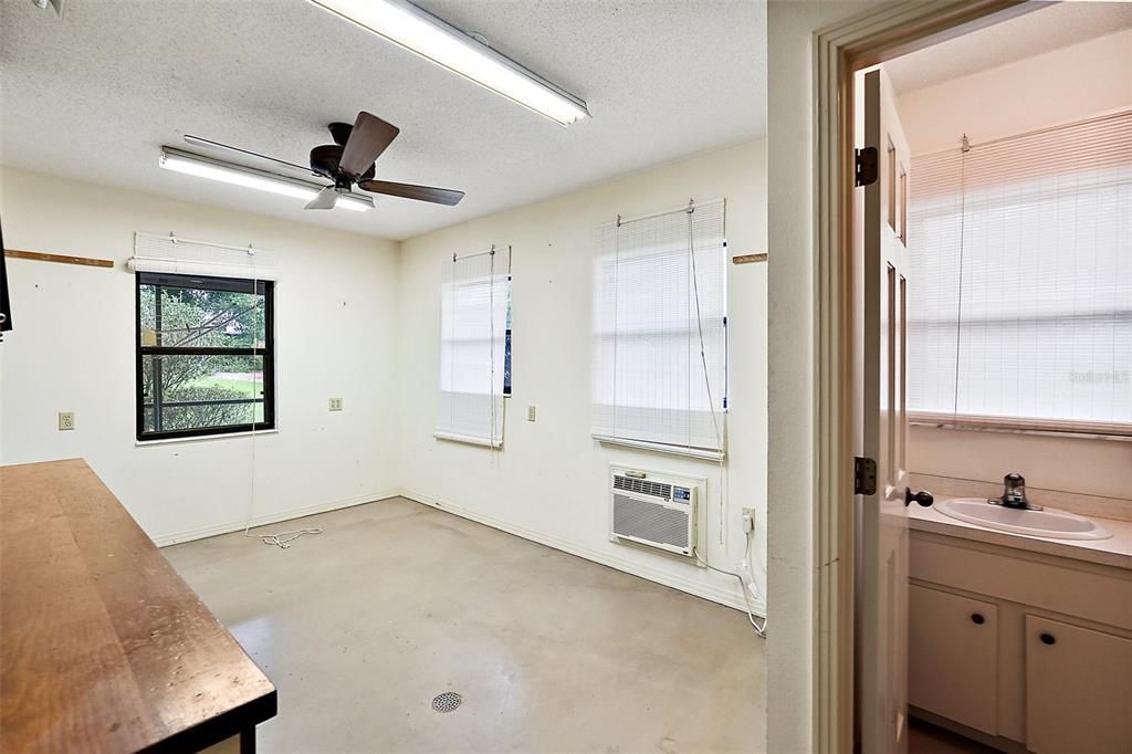 this Workshop and half bath opens to the garage.