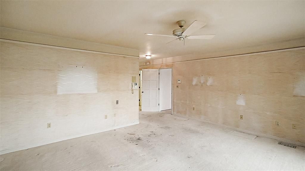 This large primary suite features 2 baths with walk-in closets and opens to the pool patio.