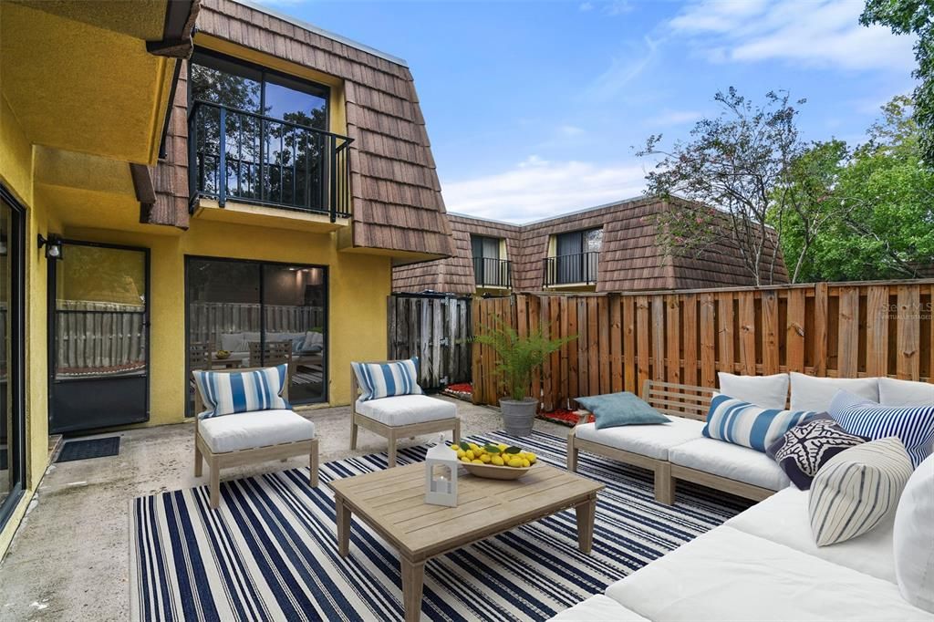 The private FENCED COURTYARD entrance also serves as a spacious patio with both bedrooms featuring Juliet balconies. Virtually Staged.