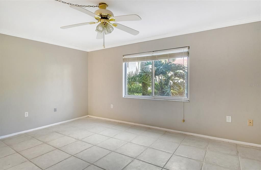 Another view of master bedroom with view of outside garden