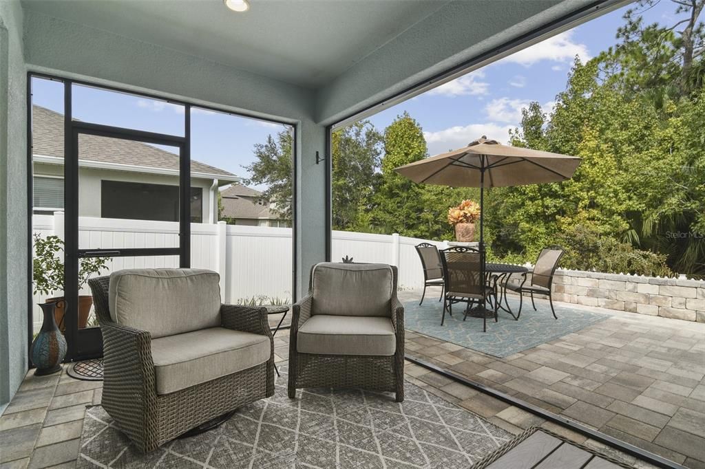 The cherry on top is the amazing backyard where you have your choice of a cozy gathering on the screened lanai...