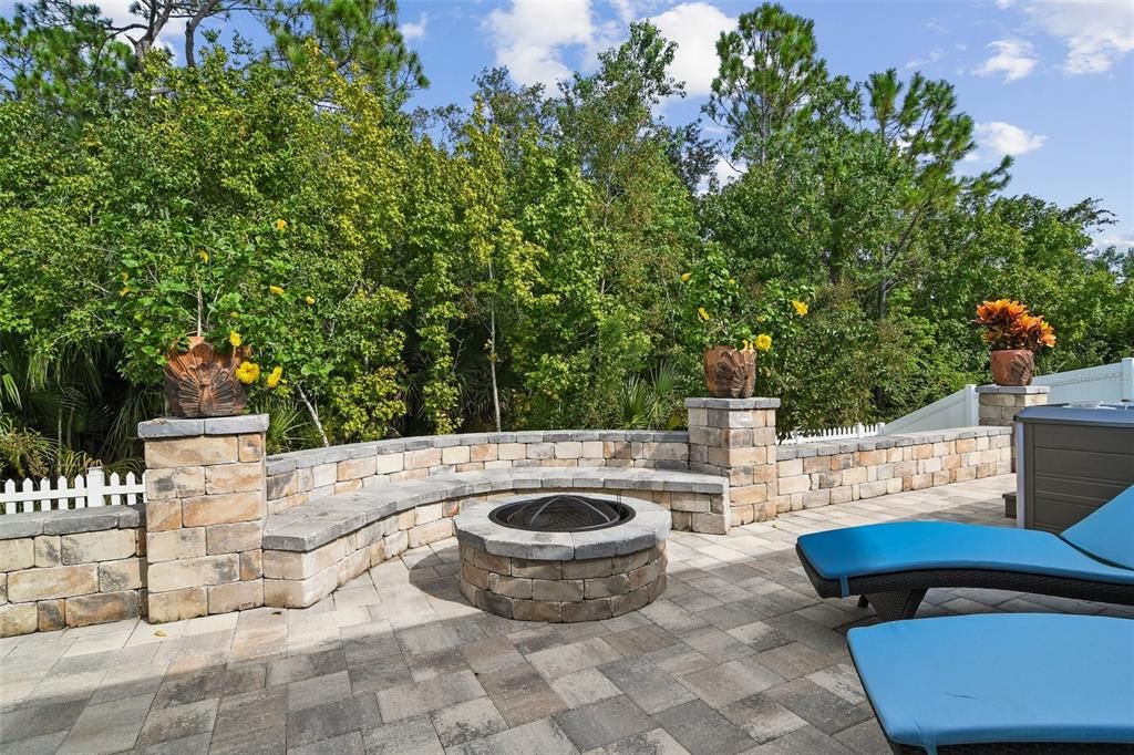 FIREPIT included as well as hot tub hookup, a vinyl privacy fence and WOODED VIEWS!