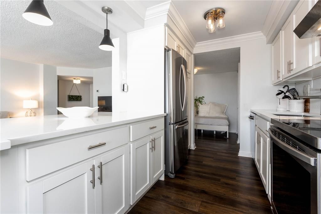 such a beautiful warm kitchen with breakfast bar