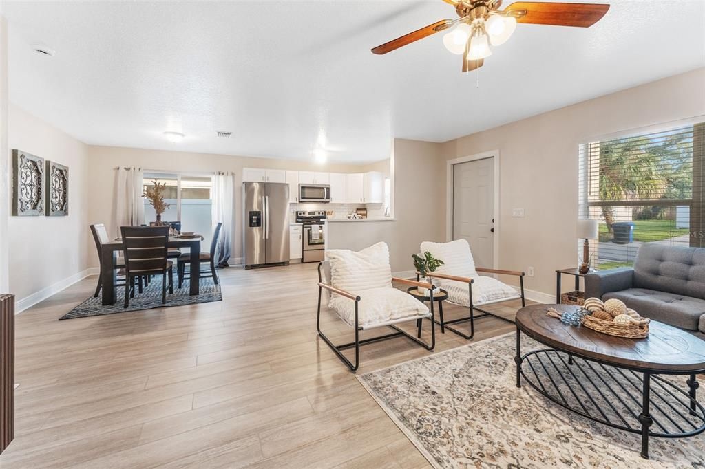 The Perfect Open Concept Space With New Flooring Throughout