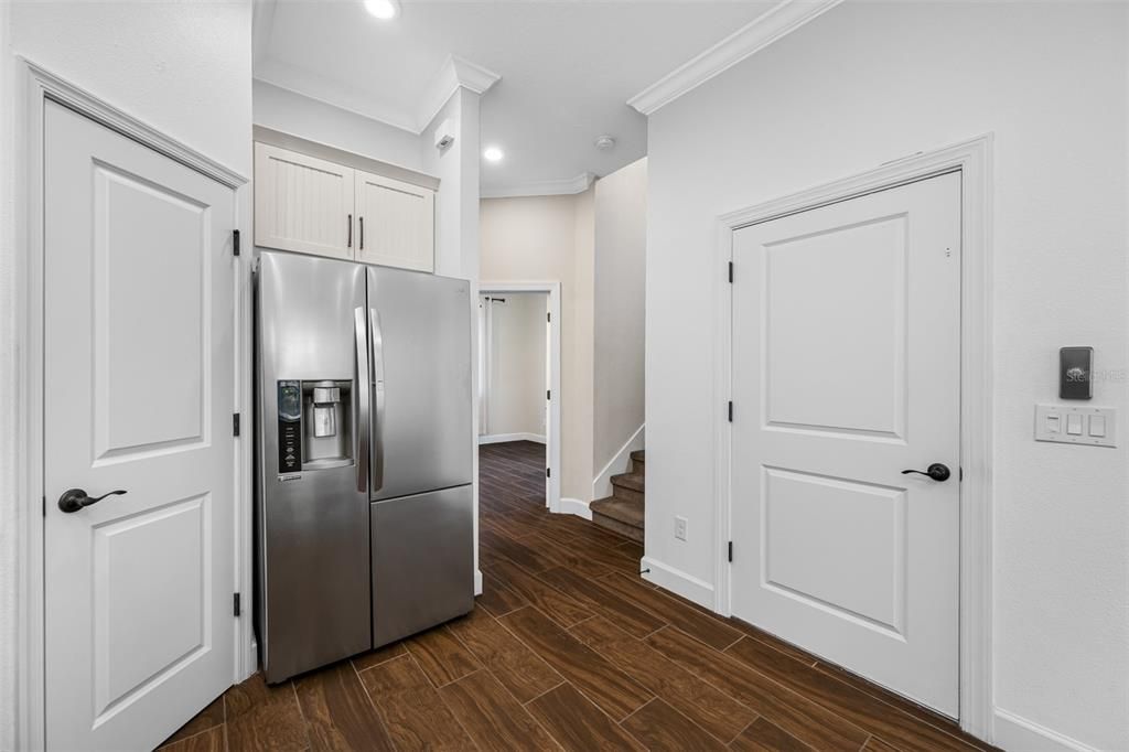 Hallway off the Kitchen showing elevator, stairs and entry to guest bedroom