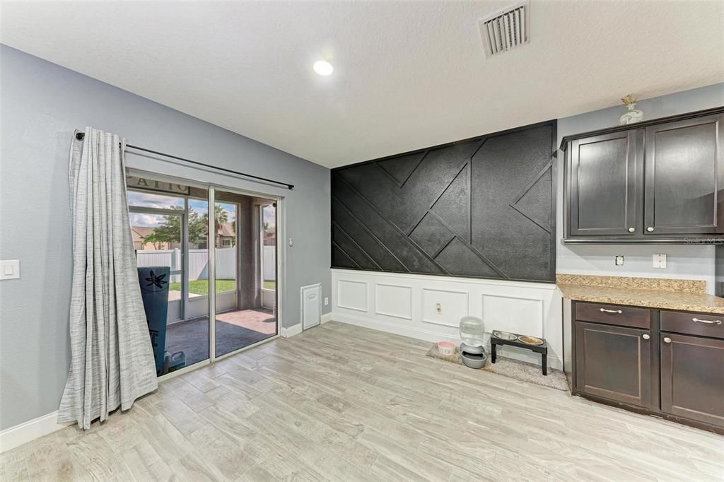 Dining Room overlooking kitchen and sliding doors to lanai