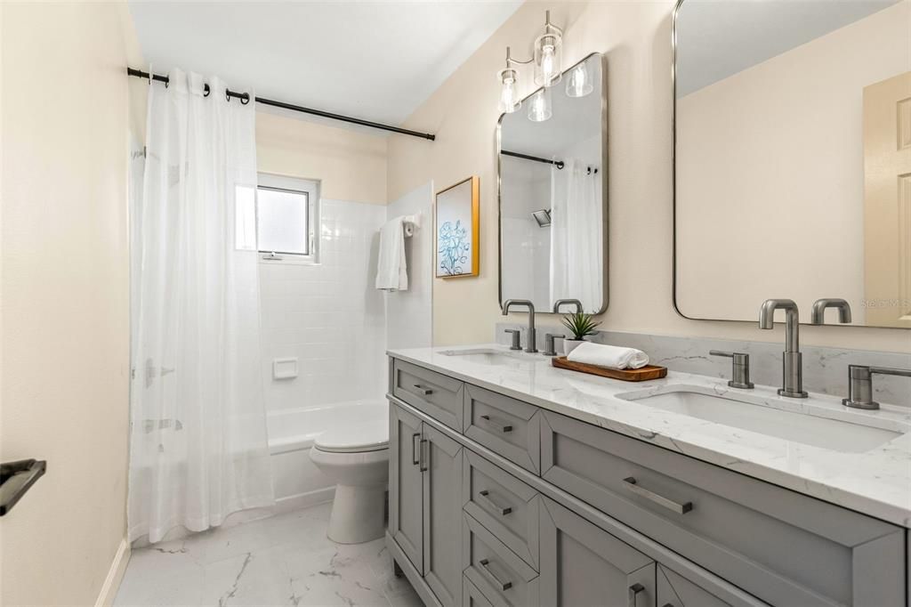 Guest hall bathroom with Quartz double sink vanity