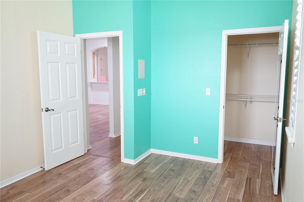 guest bedroom, door to bathroom and right side is walk in closet