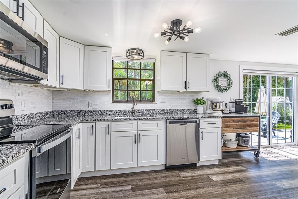 Kitchen w/ beautiful SS appliances and backsplash