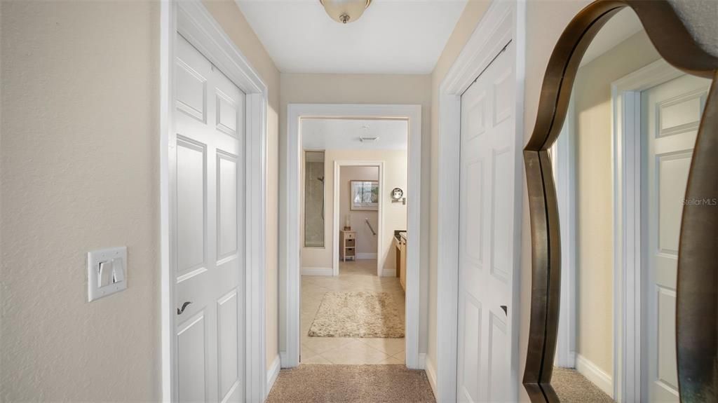 Entrance to primary bath with 2 walk in closets