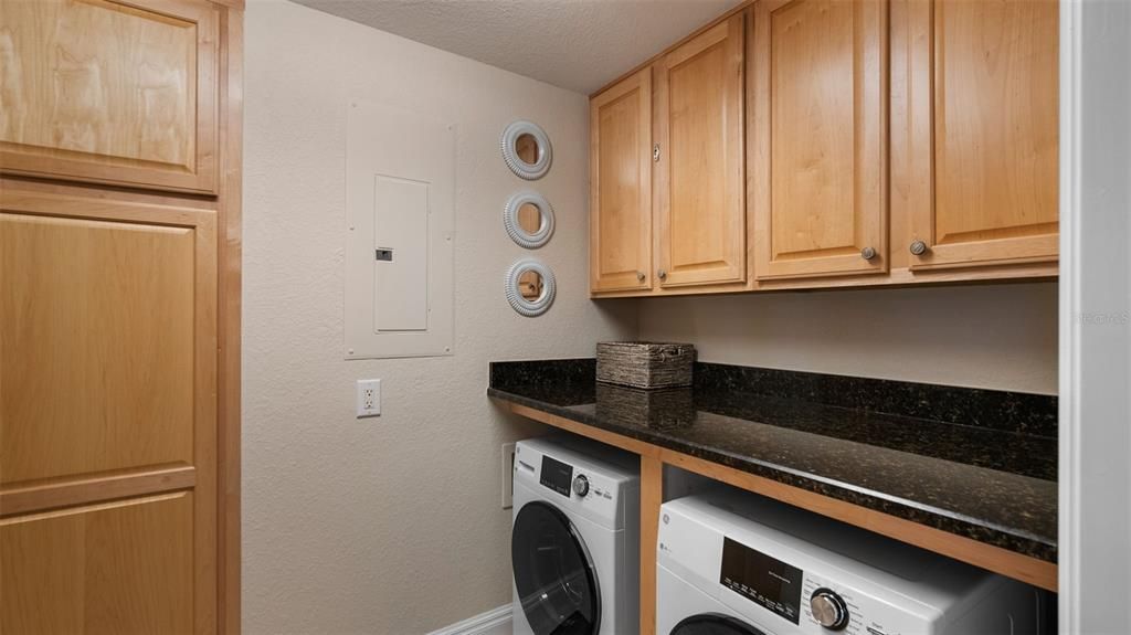 Laundry room conveniently located just off the kitchen