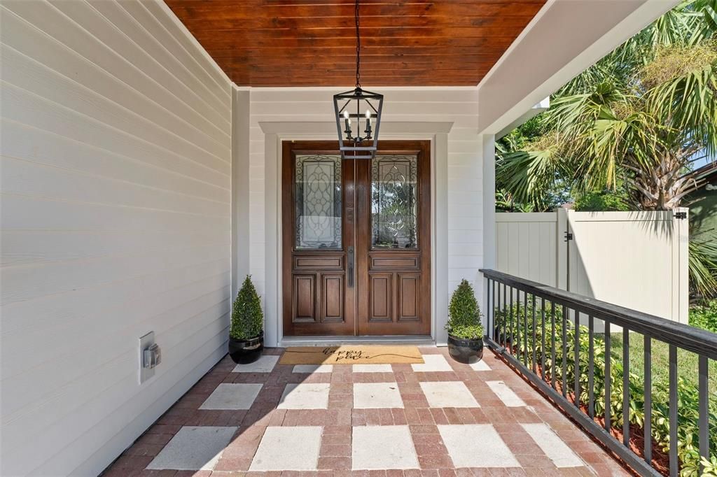 Enter through stately reclaimed SOLID WOOD double doors...