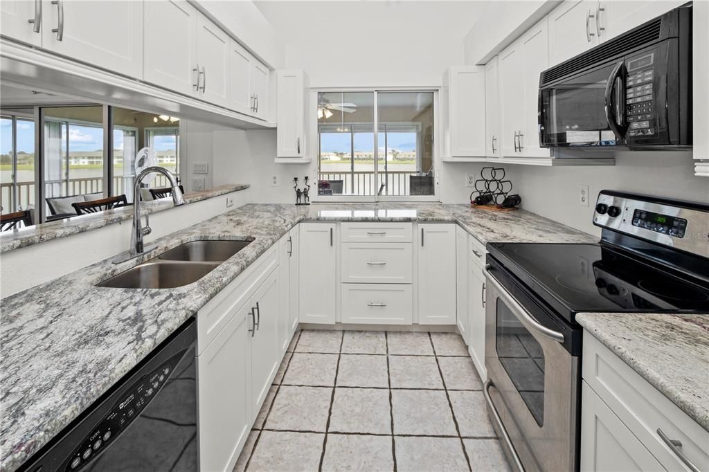 Spacious Kitchen with Gorgeous Granite and a Wonderful View of the Lake