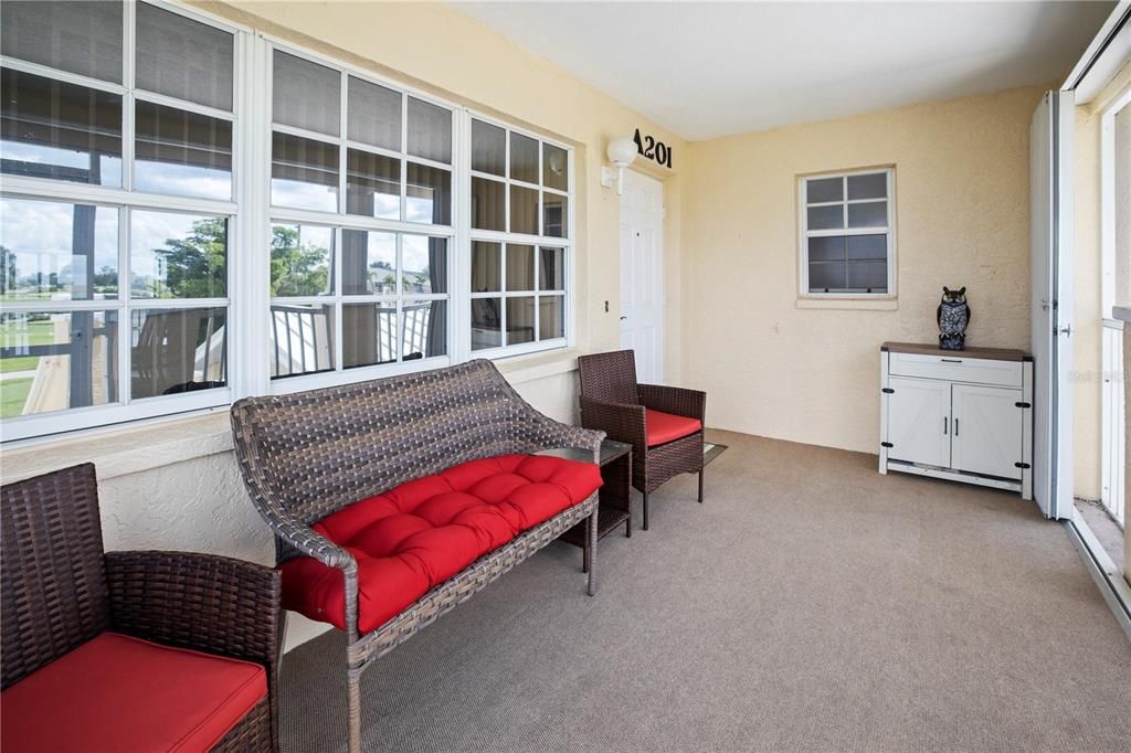 Large, Screened Front Entry with Accordian Shutters