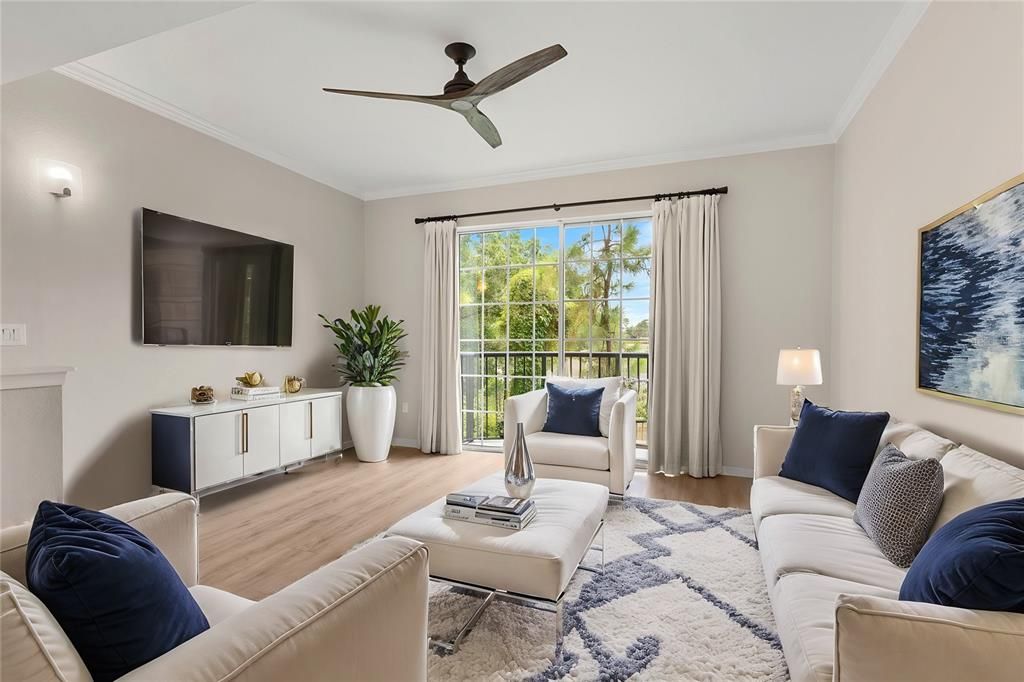 living room with nice greenery and tree view out on balcony porch and virtual staged