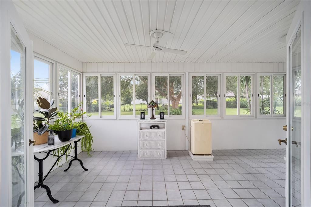 View from double glass doors with blinds and portable AC