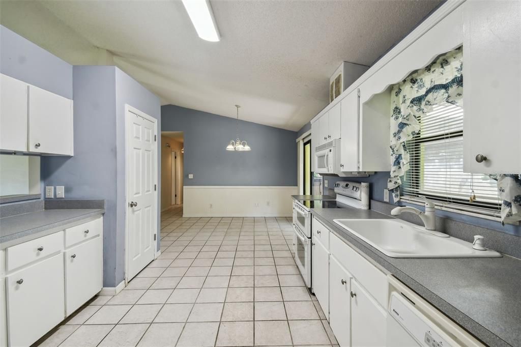 Large kitchen with vaulted ceiling and plenty of room for an island