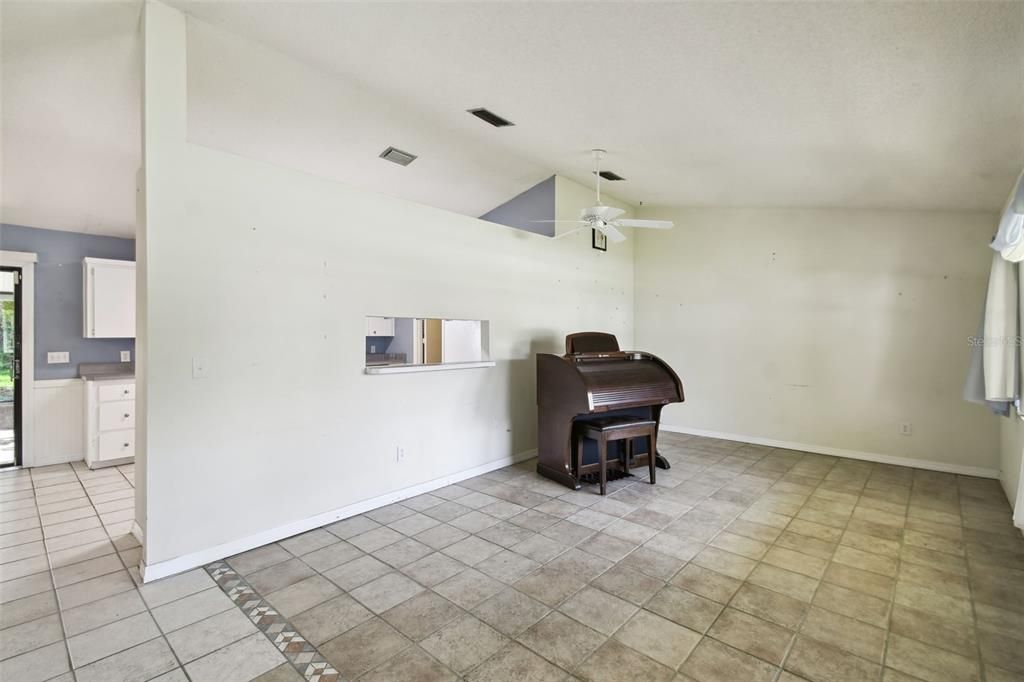 Great room has a pass through bar to the kitchen-future renovation might allow partial removal of the wall