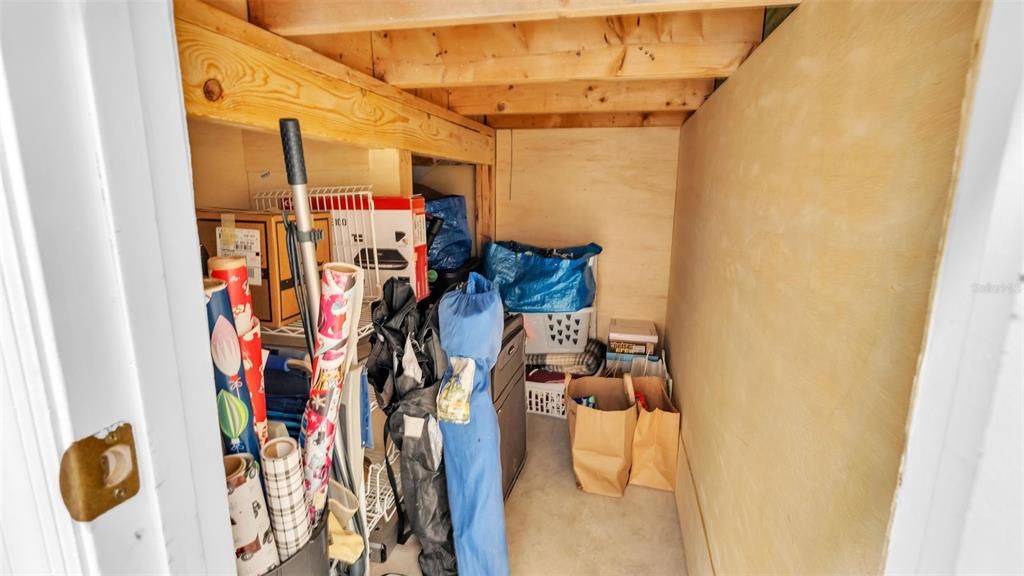 Storage under the stairs in laundry room