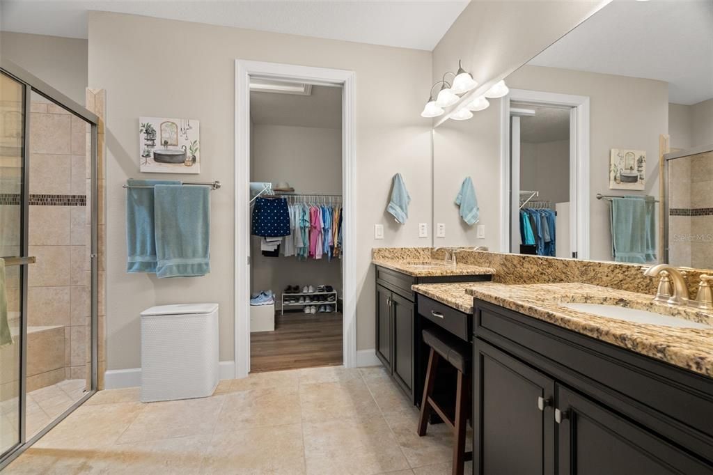 Main bath with shower, granite, pocket door to closet